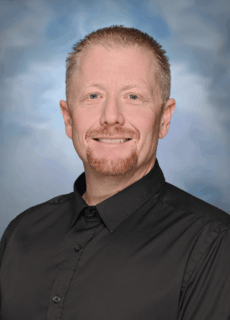 Staff portrait of a Springs Charter Schools team member.