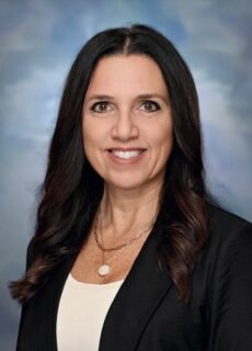 Professional staff portrait of a Springs Charter Schools team member in business attire.