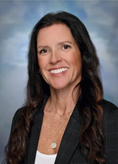 Professional staff portrait of a Springs Charter Schools team member in business attire.