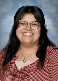 Professional staff portrait of a Springs Charter Schools team member in business attire.