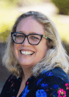 Professional staff portrait of a Springs Charter Schools team member in business attire.