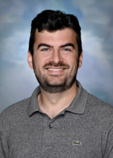 Professional staff portrait of a Springs Charter Schools team member in business attire.