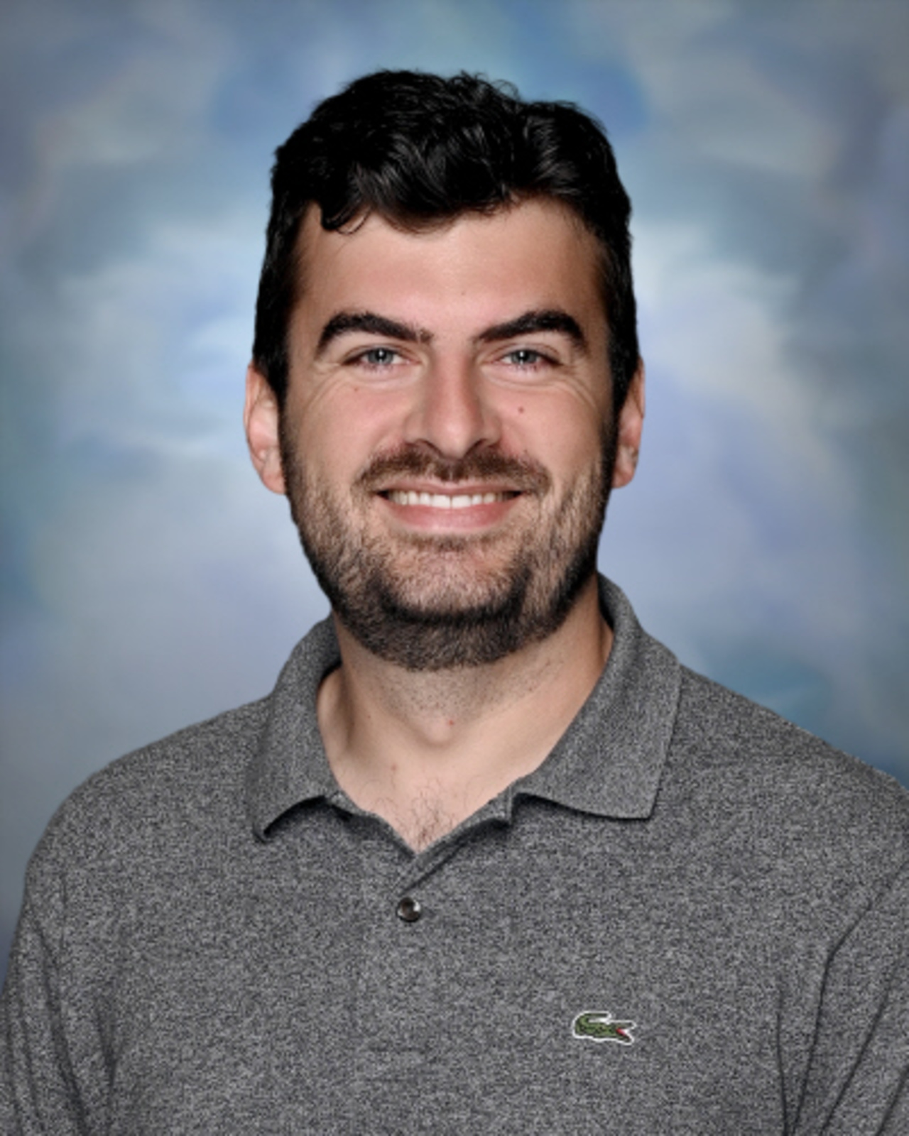 Professional staff portrait of a Springs Charter Schools team member in business attire.