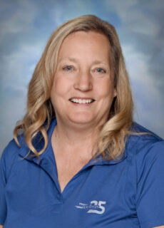 Professional staff portrait of a Springs Charter Schools team member in business attire.