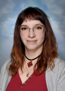 Professional staff portrait of a Springs Charter Schools team member in business attire.