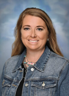 Professional staff portrait of a Springs Charter Schools team member in business attire.