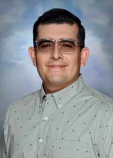 Professional staff portrait of a Springs Charter Schools team member in business attire.