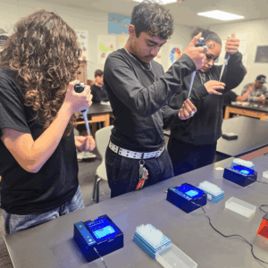 Students in Springs’ Public Safety and Medical pathway use pipettes and lab equipment during a hands-on DNA electrophoresis lab.