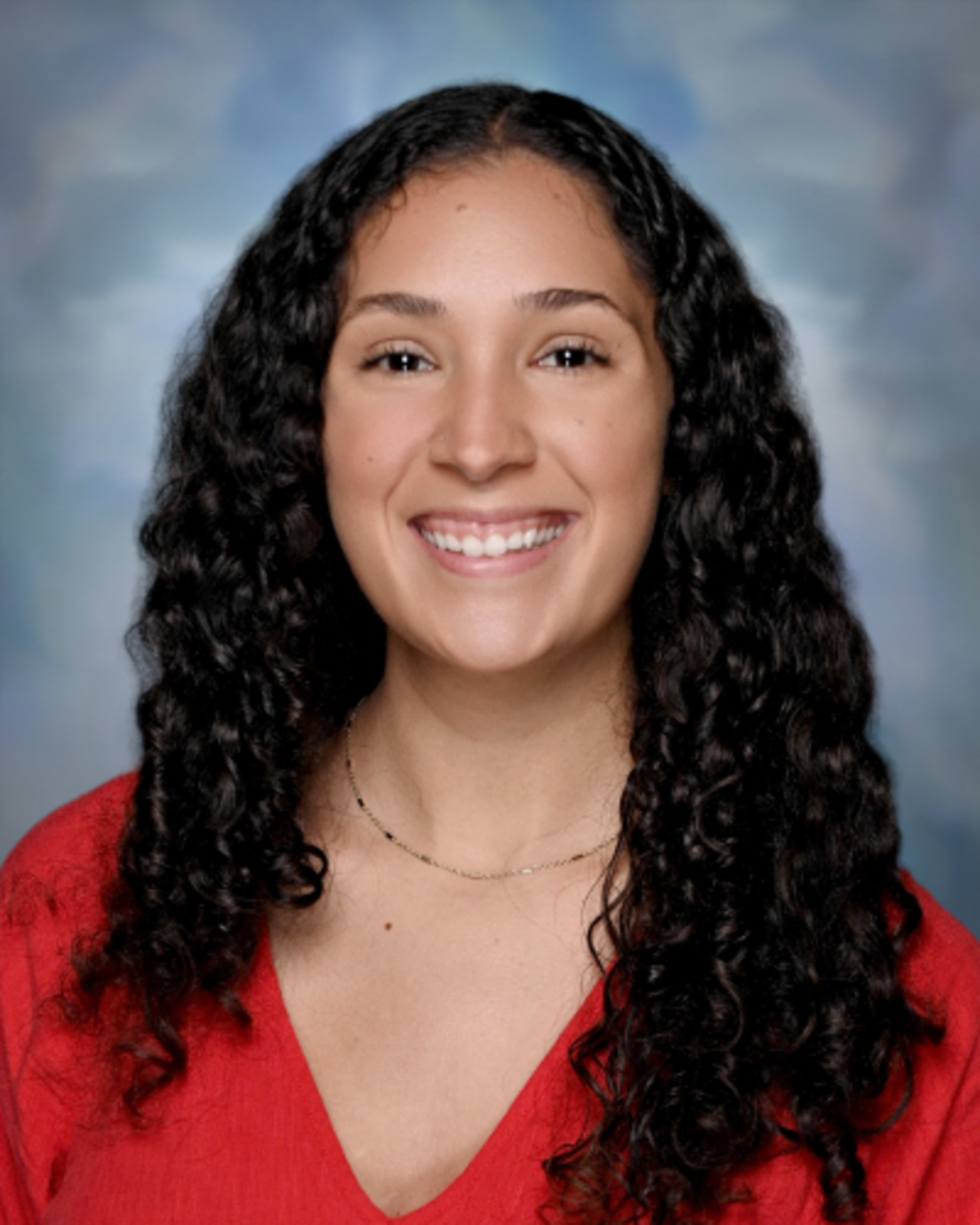 Professional staff portrait of a Springs Charter Schools team member in business attire.