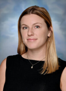 Professional staff portrait of a Springs Charter Schools team member in business attire.