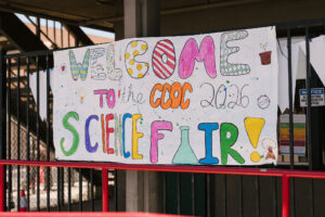 Colorful handmade “Welcome to the CCG Science Fair 2026” banner displayed at a student science fair event.