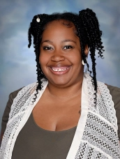 Professional staff portrait of a Springs Charter Schools team member in business attire.