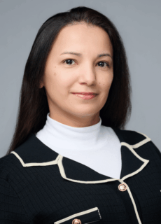 Professional staff portrait of a Springs Charter Schools team member in business attire.