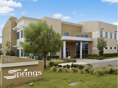 Explorer Student Center building with a springs logo in the front lawn.